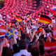 People wave flags before the start of the final of the 60th annual Eurovision Song Contest in Vienna on May 23, 2015.